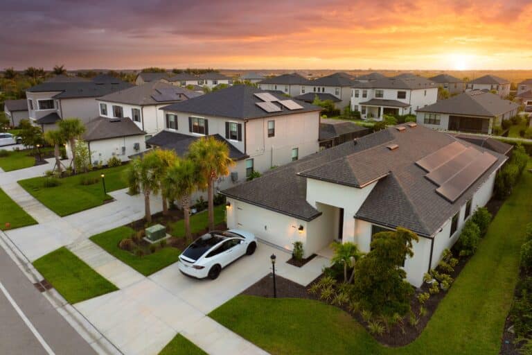 American gated community houses in rural US suburbs. View from above of large residential homes in small town in southwest Florida